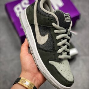 Side view of SB Dunk J Pack Shadow sneakers for adults in black and grey